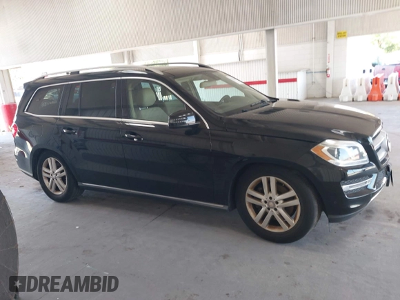 2014 Mercedes-Benz GL 450 z VIN 4JGDF7CE7EA435479, wystawiony jako IAAI lot #42280243 z przebiegiem 138 930 mil mil oraz . Historia ofert i sprzedaży dostępna na DreamBid. Obrazek 13.