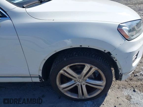 2016 Volkswagen Touareg Sport with VIN WVGEF9BP5GD012680, listed as a IAAI auction lot 41610943 with 153,952 mi miles and . Bid and sale history available at DreamBid. Image 6.