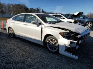 2020 Ford Fusion Hybrid SEL with VIN 3FA6P0MU0LR129742, listed as a Copart auction lot 88924535 with 79,949 mi miles and Salvage Title. Bid and sale history available at carsss.com. Image 4.