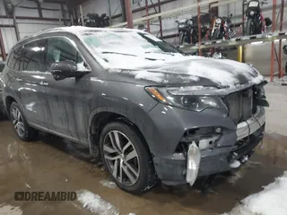 2018 Honda Pilot Touring z VIN 5FNYF5H99JB019411, wystawiony jako IAAI lot #41334034 z przebiegiem 100 143 mil mil oraz . Historia ofert i sprzedaży dostępna na DreamBid. Obrazek 1.