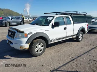 2005 Ford F-150 STX with VIN 1FTRX14W95FB53021, listed as a IAAI auction lot 42138458 with 150,885 mi miles. Bid and sale history available at carsss.com. Image 2.