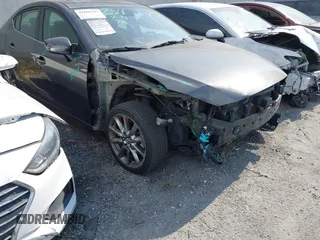2018 Mazda 3 Touring z VIN 3MZBN1V34JM260352, wystawiony jako IAAI lot #42666543 z przebiegiem 89 359 mil mil oraz . Historia ofert i sprzedaży dostępna na DreamBid. Obrazek 1.