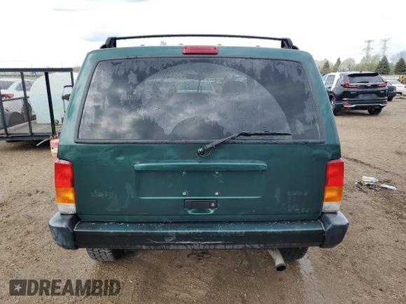 2000 Jeep Cherokee with VIN 1J4FF48S3YL149593, listed as a Copart auction lot 52489045 with 290,231 mi miles and Salvage title. Bid and sale history available at DreamBid. Image 6.