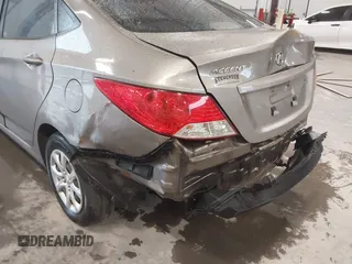 2013 Hyundai Accent GLS with VIN KMHCT4AE2DU486097, listed as a IAAI auction lot 41972806 with 295,949 mi miles. Bid and sale history available at carsss.com. Image 6.