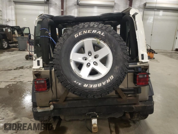 2004 Jeep Wrangler Rubicon z VIN 1J4FA69S44P784141, wystawiony jako Copart lot #55235305 z przebiegiem 125 564 mil mil oraz Szkoda całkowita • Salvage title. Historia ofert i sprzedaży dostępna na DreamBid. Obrazek 6.