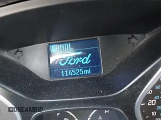 2012 Ford Focus SE z VIN 1FAHP3K27CL416859, wystawiony jako IAAI lot #41418565 z przebiegiem 114 525 mil mil oraz . Historia ofert i sprzedaży dostępna na DreamBid. Obrazek 13.