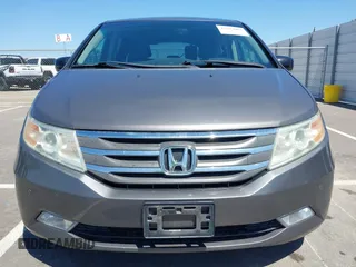 2012 Honda Odyssey Touring with VIN 5FNRL5H98CB011297, listed as a IAAI auction lot 42207061 with 154,073 mi miles and . Bid and sale history available at DreamBid. Image 12.