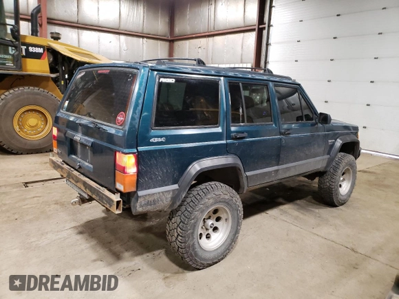 1996 Jeep Cherokee Sport with VIN 1J4FJ68S1TL226495, listed as a Copart auction lot 58587685 with 205,397 mi miles and Salvage title. Bid and sale history available at DreamBid. Image 3.