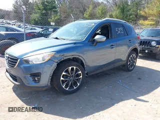 2016 Mazda CX-5 Grand Touring z VIN JM3KE4DY6G0785255, wystawiony jako IAAI lot #41887066 z przebiegiem 171 334 mil mil oraz . Historia ofert i sprzedaży dostępna na DreamBid. Obrazek 22.