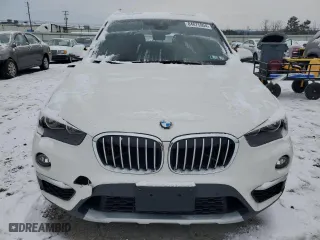 2019 BMW X1 xDrive28i with VIN WBXHT3C54K5L91407, listed as a Copart auction lot 84875904 with 97,304 mi miles and Salvage Title. Bid and sale history available at carsss.com. Image 5.