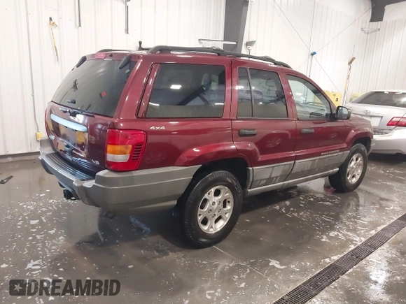 2000 Jeep Grand Cherokee Laredo z VIN 1J4GW48N8YC151600, wystawiony jako IAAI lot #42178535 z przebiegiem 71 207 mil mil oraz . Historia ofert i sprzedaży dostępna na DreamBid. Obrazek 4.
