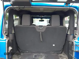 2015 Jeep Wrangler Sahara with VIN 1C4AJWBG9FL663959, listed as a IAAI auction lot 42133900 with 56,253 mi miles and . Bid and sale history available at DreamBid. Image 18.