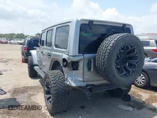 2021 Jeep Wrangler Unlimited High Altitude with VIN 1C4HJXEG3MW511185, listed as a IAAI auction lot 42125883 with 45,564 mi miles and . Bid and sale history available at DreamBid. Image 3.