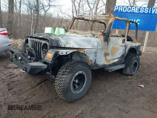 2003 Jeep Wrangler Sport with VIN 1J4FA49S93P374406, listed as a IAAI auction lot 41648982 with Not provided miles and . Bid and sale history available at DreamBid. Image 2.