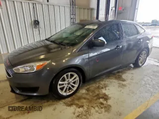 2018 Ford Focus SE with VIN 1FADP3FE0JL311760, listed as a Copart auction lot 63621755 with 81,000 mi miles and Salvage title. Bid and sale history available at DreamBid. Image 1.