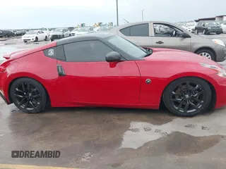 2016 Nissan 370Z z VIN JN1AZ4EHXGM932681, wystawiony jako IAAI lot #42350850 z przebiegiem 94 586 mil mil oraz . Historia ofert i sprzedaży dostępna na DreamBid. Obrazek 13.