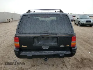 1997 Jeep Grand Cherokee Limited z VIN 1J4GZ78Y8VC586034, wystawiony jako Copart lot #58061705 z przebiegiem 244 355 mil mil oraz Czysty tytuł • Clean title. Historia ofert i sprzedaży dostępna na DreamBid. Obrazek 6.
