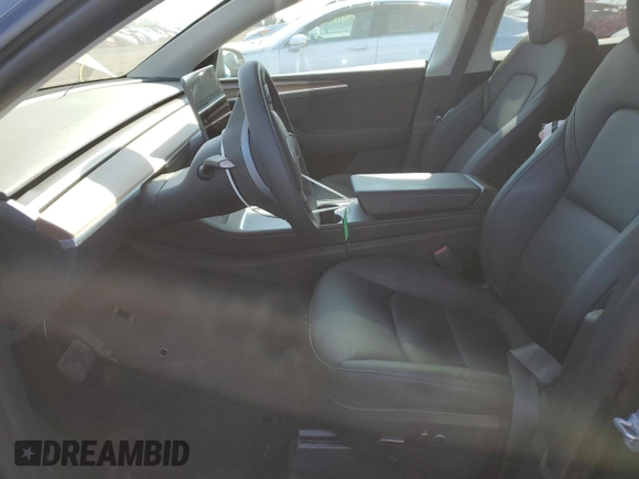 2024 Tesla Model Y with VIN 7SAYGDED7RF163537, listed as a Copart auction lot 48639255 with 7,193 mi miles and Salvage Title. Bid and sale history available at DreamBid. Image 7.