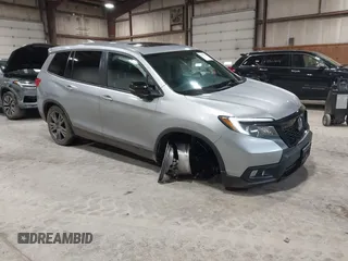 2021 Honda Passport EX-L with VIN 5FNYF8H56MB000107, listed as a IAAI auction lot 41868429 with 66,572 mi miles and . Bid and sale history available at DreamBid. Image 1.