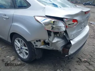 2017 Ford Focus SE with VIN 1FADP3F25HL335102, listed as a IAAI auction lot 42010697 with 77,389 mi miles. Bid and sale history available at carsss.com. Image 6.