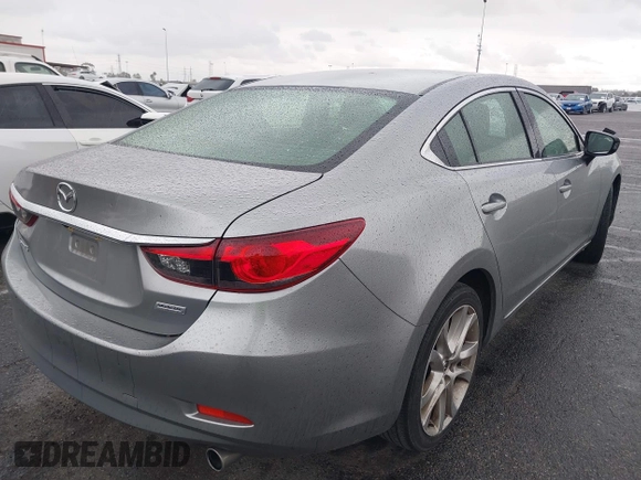 2014 Mazda 6 i Touring with VIN JM1GJ1V60E1141831, listed as a IAAI auction lot 42131200 with 86,597 mi miles and . Bid and sale history available at DreamBid. Image 4.