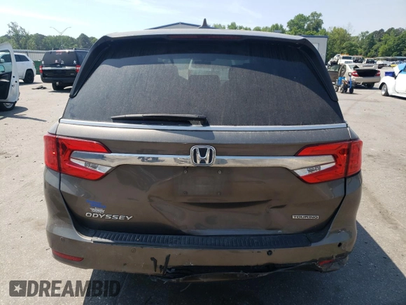 2019 Honda Odyssey Touring z VIN 5FNRL6H87KB098010, wystawiony jako Copart lot #54791505 z przebiegiem 94 477 mil mil oraz Szkoda całkowita • Salvage title. Historia ofert i sprzedaży dostępna na DreamBid. Obrazek 6.