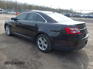 2013 Ford Taurus SEL with VIN 1FAHP2E87DG220389, listed as a IAAI auction lot 41930118 with 128,324 mi miles and . Bid and sale history available at carsss.com. Image 3.