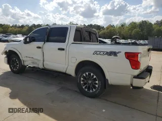 2019 Nissan Titan Pro-4X z VIN 1N6AA1E51KN526104, wystawiony jako Copart lot #51694335 z przebiegiem 56 620 mil mil oraz Szkoda całkowita • Salvage title. Historia ofert i sprzedaży dostępna na DreamBid. Obrazek 2.