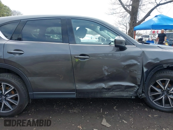 2018 Mazda CX-5 Grand Touring with VIN JM3KFBDM6J0388540, listed as a IAAI auction lot 41963726 with 103,148 mi miles. Bid and sale history available at carsss.com. Image 13.