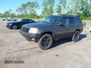 2002 Jeep Grand Cherokee z VIN 1J4GX38S32C238339, wystawiony jako IAAI lot #42653341 z przebiegiem 264 189 mil mil oraz . Historia ofert i sprzedaży dostępna na DreamBid. Obrazek 2.