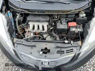 2010 Honda Fit z VIN JHMGE8H22AS027239, wystawiony jako Copart lot #59358935 z przebiegiem 121 802 mil mil oraz Czysty tytuł • Clean title. Historia ofert i sprzedaży dostępna na DreamBid. Obrazek 11.