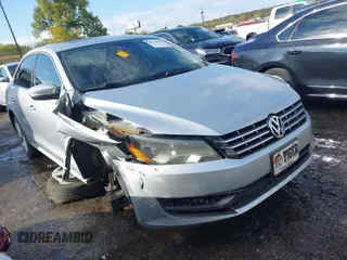 2014 Volkswagen Passat SE z VIN 1VWBN7A33EC060093, wystawiony jako IAAI lot #40743090 z przebiegiem 106 489 mil mil oraz . Historia ofert i sprzedaży dostępna na DreamBid. Obrazek 1.