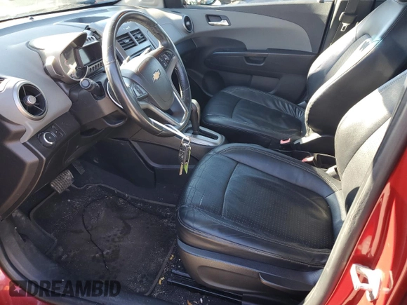 2012 Chevrolet Sonic LTZ z VIN 1G1JE5SHXC4126894, wystawiony jako Copart lot #45186475 z przebiegiem 76 461 mil mil oraz Czysty tytuł • Clean title. Historia ofert i sprzedaży dostępna na DreamBid. Obrazek 7.