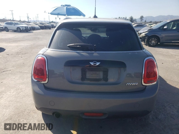 2016 MINI Hardtop 4 Door with VIN WMWXU1C59G2D11117, listed as a Copart auction lot 65191715 with 121,633 mi miles and Salvage title. Bid and sale history available at DreamBid. Image 6.