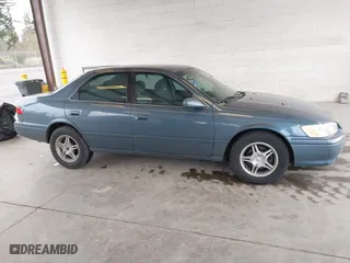 2000 Toyota Camry CE with VIN 4T1BG22KXYU923956, listed as a IAAI auction lot 41937950 with 101,539 mi miles. Bid and sale history available at carsss.com. Image 14.