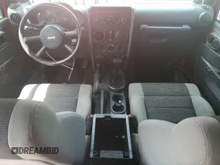 2007 Jeep Wrangler Unlimited X with VIN 1J4GA39187L161451, listed as a Copart auction lot 55280905 with 214,660 mi miles and Salvage Title. Bid and sale history available at DreamBid. Image 8.