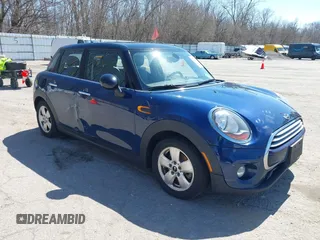 2015 MINI Hardtop 4 Door with VIN WMWXS5C58FT829805, listed as a IAAI auction lot 42023026 with 141,330 mi miles and . Bid and sale history available at DreamBid. Image 1.