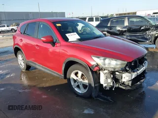 2016 Mazda CX-5 Touring z VIN JM3KE2CY6G0806644, wystawiony jako IAAI lot #41787086 z przebiegiem 152 030 mil mil oraz . Historia ofert i sprzedaży dostępna na DreamBid. Obrazek 1.