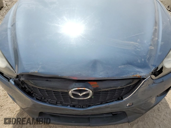 2015 Mazda CX-5 Sport z VIN JM3KE2BE8F0434116, wystawiony jako Copart lot #60712625 z przebiegiem 300 405 mil mil oraz Szkoda całkowita • Salvage title. Historia ofert i sprzedaży dostępna na DreamBid. Obrazek 12.