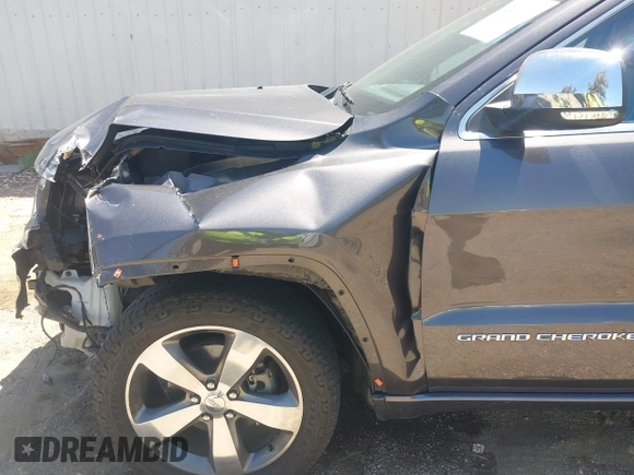 2015 Jeep Grand Cherokee Overland with VIN 1C4RJFCG7FC839778, listed as a IAAI auction lot 42490111 with 160,040 mi miles and . Bid and sale history available at DreamBid. Image 6.