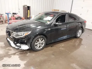 2017 Kia Optima LX with VIN 5XXGT4L31HG165150, listed as a IAAI auction lot 40985407 with 154,945 mi miles. Bid and sale history available at carsss.com. Image 2.