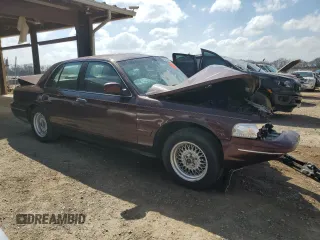 2001 Ford Crown Victoria LX z VIN 2FAFP74W31X189359, wystawiony jako Copart lot #49348255 z przebiegiem Nie podano mil oraz Nie do naprawy. Historia ofert i sprzedaży dostępna na DreamBid. Obrazek 4.