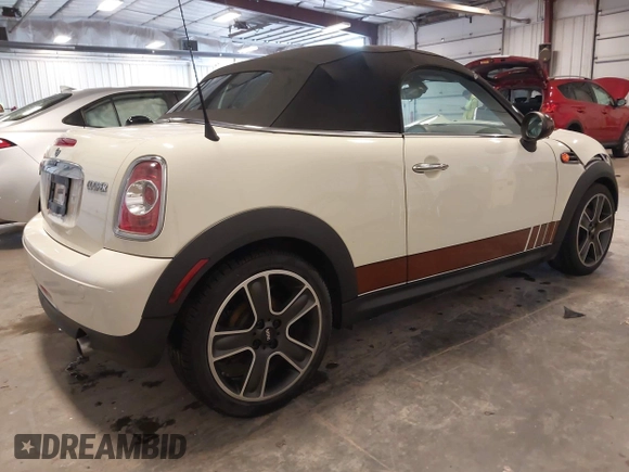 2013 MINI Roadster with VIN WMWSY1C52DT625564, listed as a IAAI auction lot 41442864 with 98,240 mi miles and . Bid and sale history available at DreamBid. Image 4.