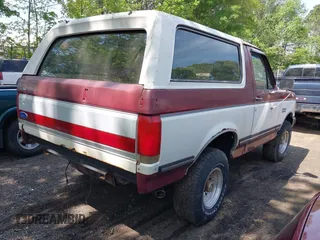 1989 Ford Bronco XL with VIN 1FMEU15N8KLB48656, listed as a IAAI auction lot 42142524 with 87,459 mi miles. Bid and sale history available at carsss.com. Image 4.