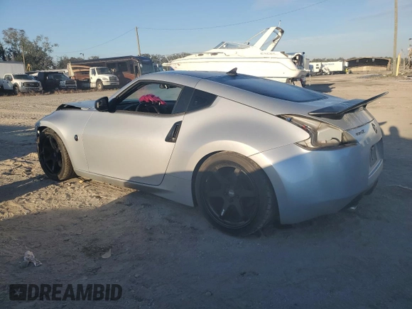 2015 Nissan 370Z with VIN JN1AZ4EH2FM443464, listed as a Copart auction lot 83410654 with 116,692 mi miles and Salvage Title. Bid and sale history available at carsss.com. Image 2.