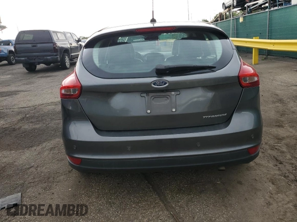 2016 Ford Focus Titanium z VIN 1FADP3N27GL329026, wystawiony jako Copart lot #60910475 z przebiegiem 98 794 mil mil oraz Szkoda całkowita • Salvage title. Historia ofert i sprzedaży dostępna na DreamBid. Obrazek 6.
