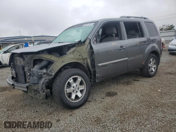 2011 Honda Pilot Touring z VIN 5FNYF4H94BB046303, wystawiony jako Copart lot #58017515 z przebiegiem 118 384 mil mil oraz Szkoda całkowita • Salvage title. Historia ofert i sprzedaży dostępna na DreamBid. Obrazek 1.