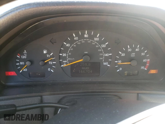 2000 Mercedes-Benz E-Class AWD with VIN WDBJF82JXYX035315, listed as a Copart auction lot 75568454 with 166,704 mi miles and Salvage Title. Bid and sale history available at carsss.com. Image 9.