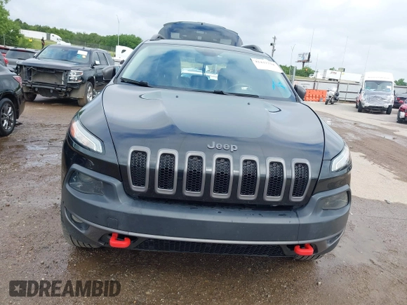 2015 Jeep Cherokee Trailhawk with VIN 1C4PJMBS5FW647601, listed as a IAAI auction lot 42437734 with 170,640 mi miles and . Bid and sale history available at DreamBid. Image 13.