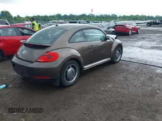 2012 Volkswagen Beetle 2.5L PZEV with VIN 3VWJP7AT2CM638265, listed as a IAAI auction lot 42512449 with 137,129 mi miles and . Bid and sale history available at DreamBid. Image 4.